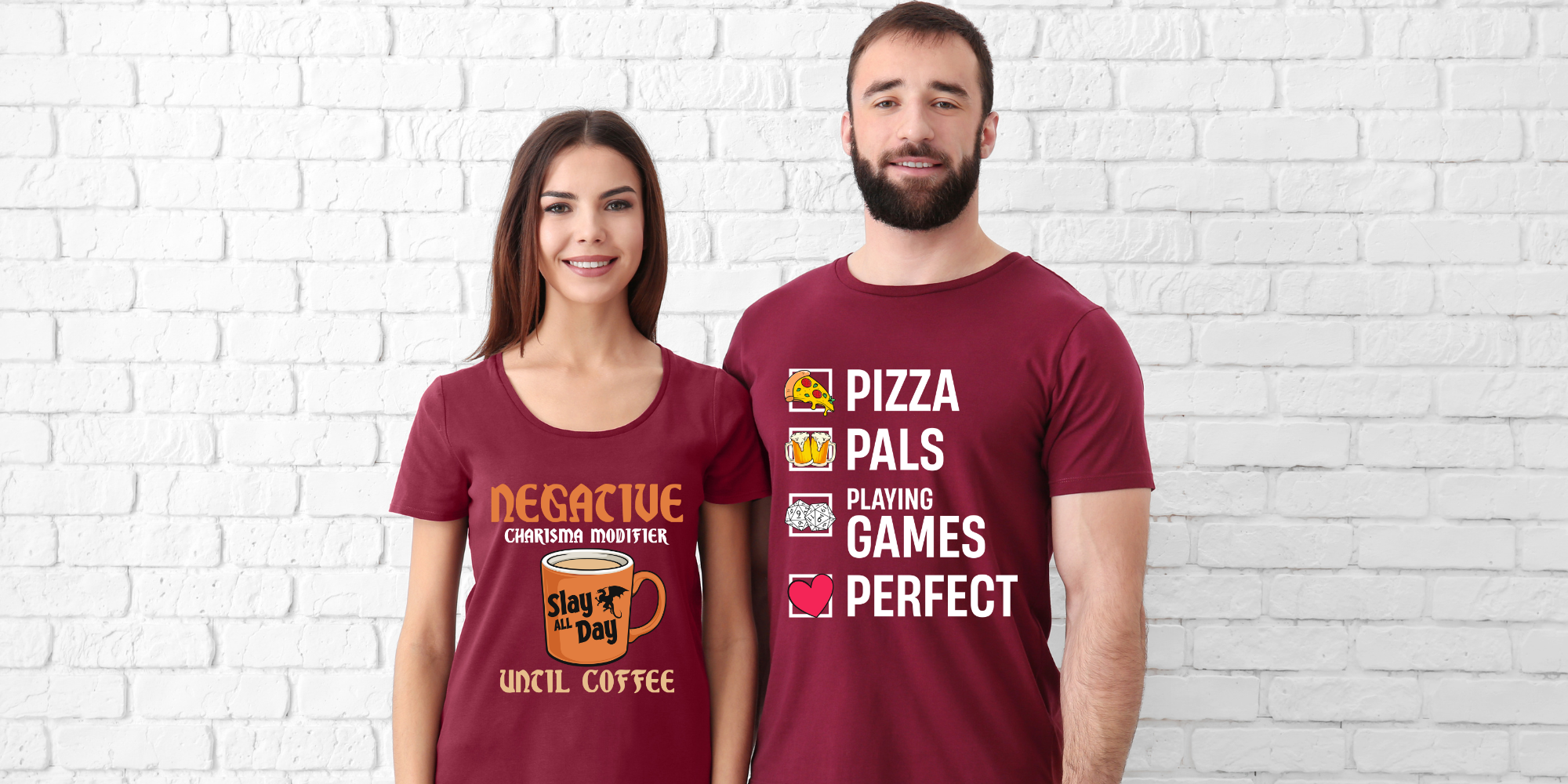 Woman and man wearing maroon t-shirts with TTRPG-themed sayings on them.
