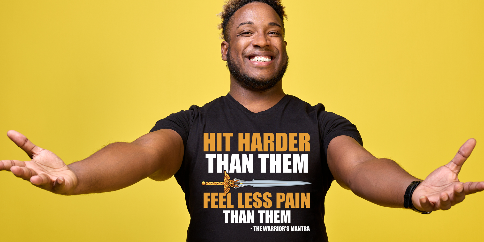 Man standing against a yellow background and wearing a black t-shirt with a TTRP-themed saying and artwork.